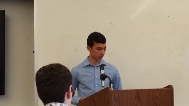 Geo Huete introduces the guest speaker, his grandfather Rodrigo Huete.