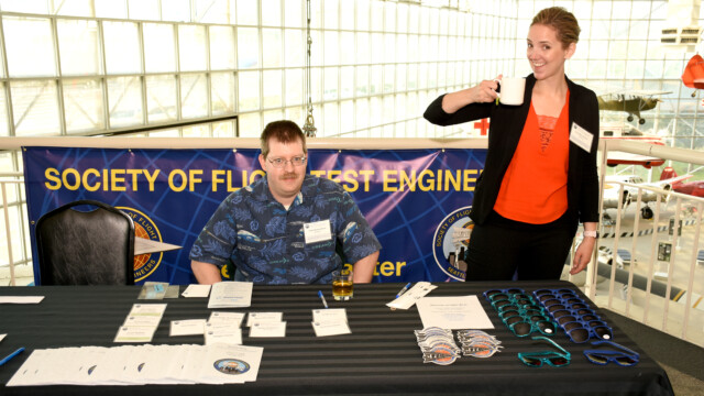 Tom “Oddball” Osmundson, Seattle Chapter Treasurer, and Jennifer Boyles, Seattle Chapter Secretary, at the check-in table at the start of the Friday Symposium.