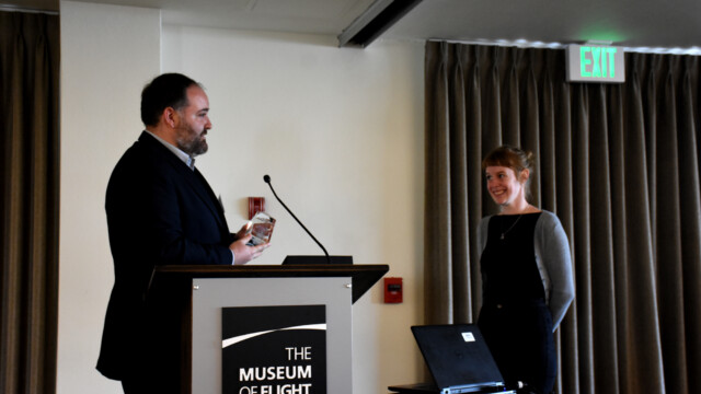 Hilary Lawlor acceps her Best Presentation Award from Seattle SFTE Chapter President Noah Aaron. Hilary gave a talk about her research into printed sensor technology. This tech would allow for inexpensive and innovative installations of skin sensors directly on the surface of aircraft parts.