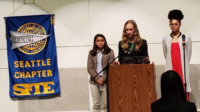 Raisbeck Aviation High School students give a presentation detailing their test results to the attendees.